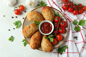 Concept of tasty food with cutlets on white textured table