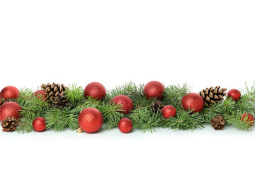 Spruce branches with Christmas baubles isolated on white background