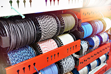 Bobbins of colored rope in store