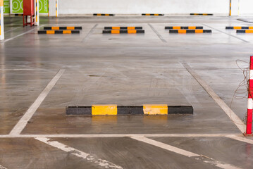 Empty Block of car park with bunker to stop wheel for control distance with space
