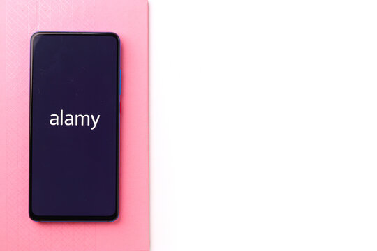 Assam, india - April 19, 2021 : Alamy logo on phone screen stock image.