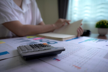 Calculator with background Businesswoman working about tax, accounting, statistics, and analytic...