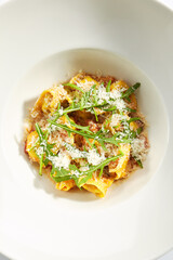 Tortellini with Perch and Tomato Sauce in Restaurant Isolated