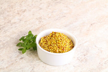 Grain mustard sauce in the bowl