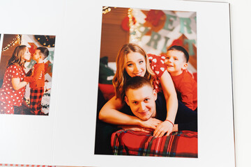pages of photobook from a new year's family photo shoot