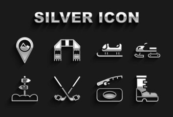 Set Ice hockey sticks, Snowmobile, Waterproof rubber boot, Winter fishing, Road traffic signpost, Sled, Location with mountain and scarf icon. Vector