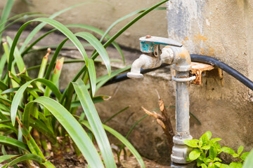 Old iron faucet in the park