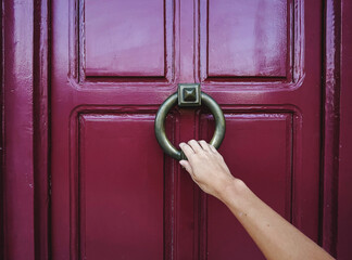 Hand opening the door