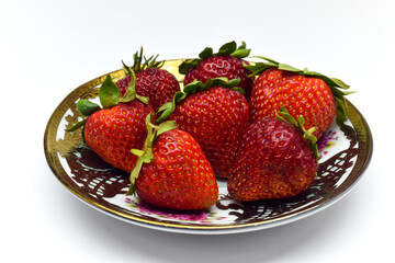 A bunch of strawberries on a plate