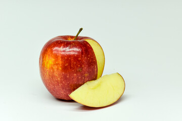 Apple with open slice on a white background