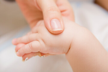 A close up of mother hand holding a baby hand