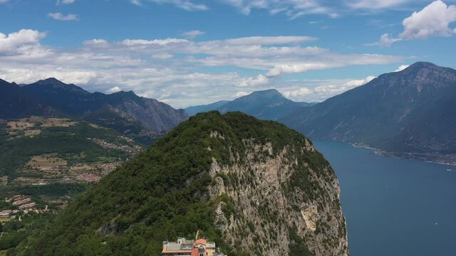 Panorama Eremo di Montecastello in Italy aerial view. Catholic church on a mountain surrounded by the Alps. Aerial panorama of the Eremo di Montecastello church on Lake Garda.