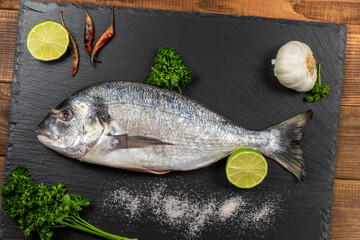 Sea bream and ingredients for cooking