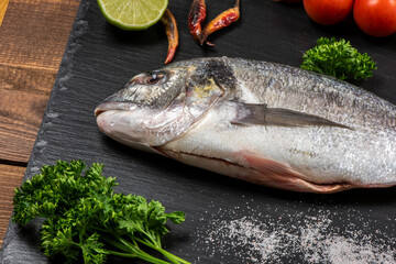 Sea bream and ingredients for cooking
