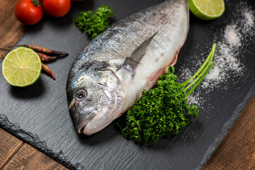 Sea bream and ingredients for cooking