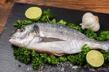 Sea bream and ingredients for cooking