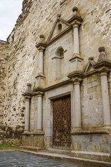 Fototapeta na wymiar Main facade in Renaissance style of Mare de Deu dels Angels church in Llivia, Catalonia, Spain.