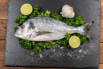 Sea bream and ingredients for cooking