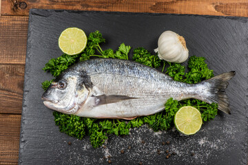 Sea bream and ingredients for cooking