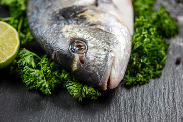 Sea bream and ingredients for cooking