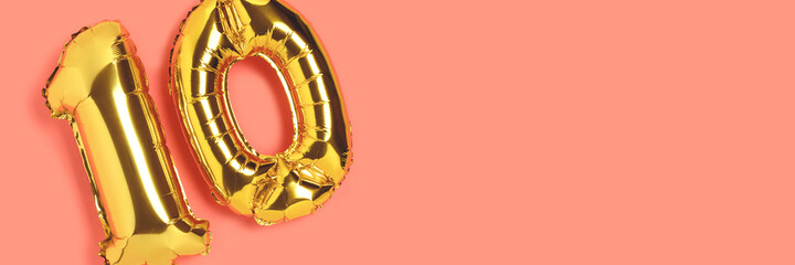 Banner with number 10 golden balloons with place for text. Ten years anniversary celebration...