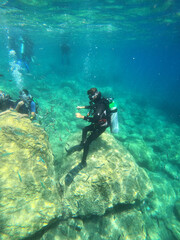 Tourists scuba dive Mediterranian Sea. Marmaris,Turkey.