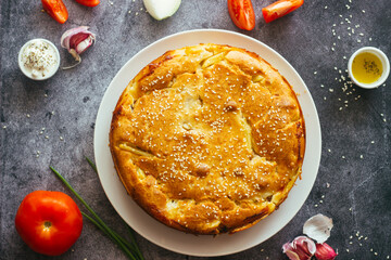 Chicken and potato pie. Tasty pie. Pie and vegetables on the table 