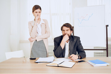 secretary sitting on the table next to the boss office professional job