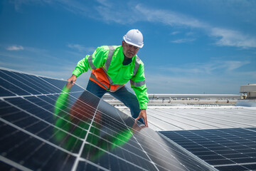 Engineer wearing unifrom and helmet inspect and check solar cell panel ,solar cell is ecology energy sunlight power installation for industrail ,alternative environment power concept.