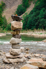Different form rock balanced on the beach 