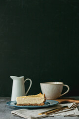 Bakery products. A piece of homemade cheesecake and a mug of coffee. Dessert.