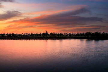 Lake and natural scenery in the park at sunset in summer, Asia