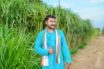 indian farmer at sugarcane field
