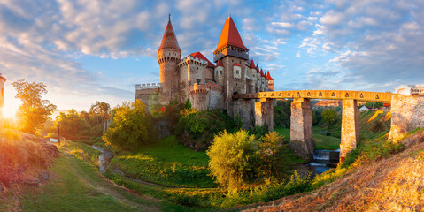 hunedoara, romania - OCT 13, 2019: corvin castle at sunrise. panoramic view of medieval...