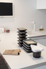 Close up of disposable boxes with food, sorted by meals