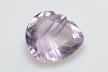 Natural stone purple amethyst on a white background