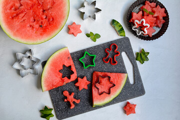 The flesh of the watermelon is cut into asterisks. Forms for baking cookies. Flat composition, top...