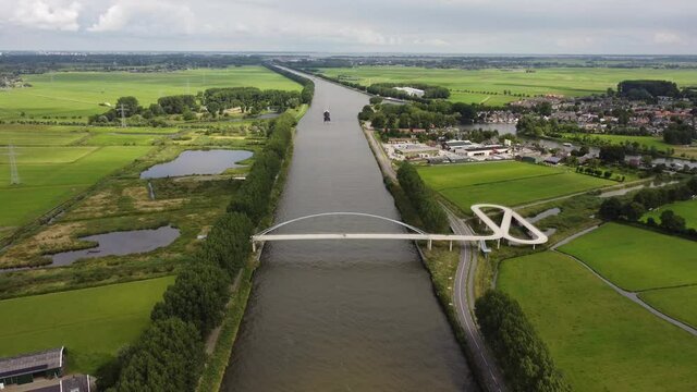 Pedestrian and cyclist bridge over the Amsterdams Rijn Canal,  waterway in Nigtevecht The Netherlands. Liniebrug