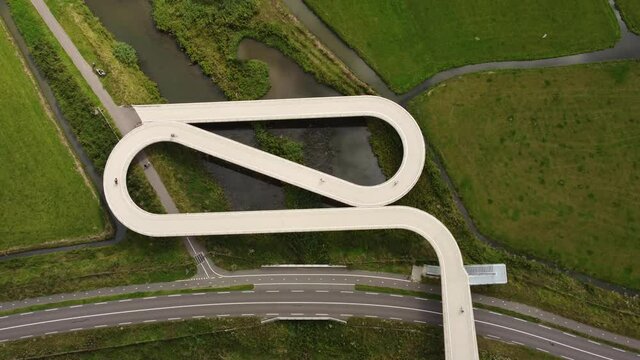 Pedestrian and cyclist bridge over the Amsterdams Rijn Canal,  waterway in Nigtevecht The Netherlands. Liniebrug