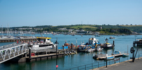 Plymouth, Devon, England, UK. 2021.  The commercial shipping zone and metal walkway for passenger...