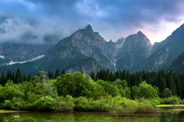 Stormy Clouds Over Alpine Lake in Fusine Italy