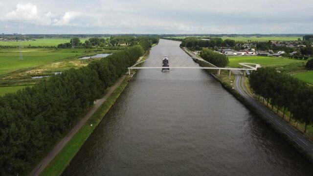 Pedestrian and cyclist bridge over the Amsterdams Rijn Canal,  waterway in Nigtevecht The Netherlands. Liniebrug