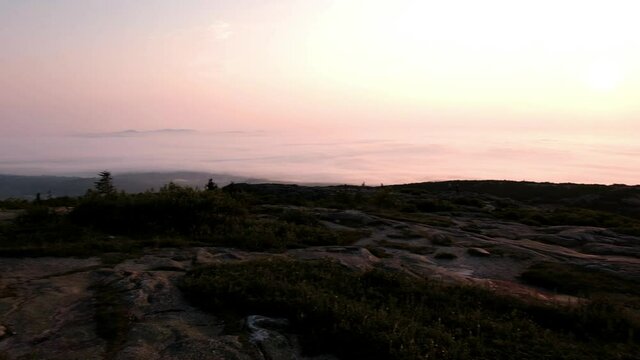 Sunrise moments above the clouds on top of Cadillac Mountain, Maine, USA. 