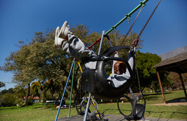 Young black girl child on a swing
