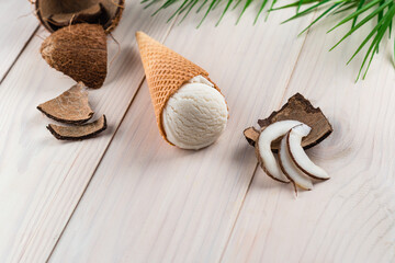 coconut ice cream on a white wooden background