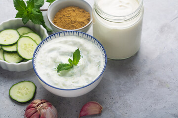 Traditional Indian Raita with Dahi in a bowl, served with mint