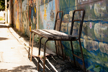 Naklejka na ściany i meble Vintage old chair on the street