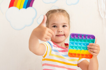 Happy Girl with Pop It Colorful Rainbow, Pop Fidget Sensory Toy, Fashion Toys and Antistress
