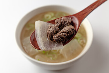 Beef radish soup on a white background