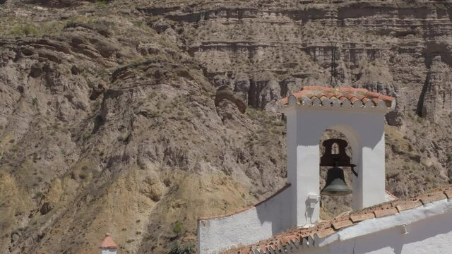 Bell tower in a little church of a village mediterranean in the dessert